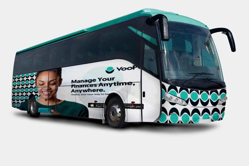 VooPay bus wrap design featuring a smiling woman using a smartphone, teal and black circular patterns, and the tagline ‘Manage your finances anytime, anywhere.